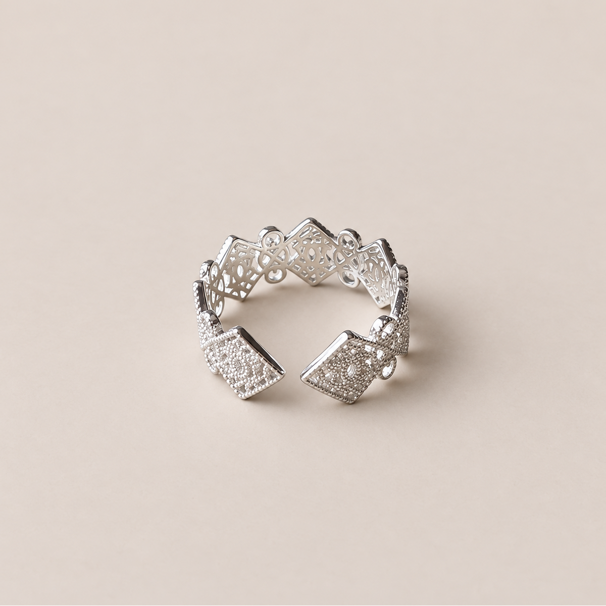 Adjustable opening and repeating geometric panels of the silver ring