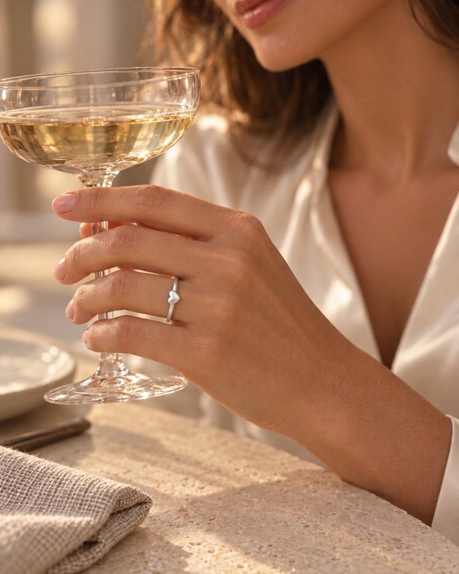 Minimal silver heart ring styled for The Celebration Edit