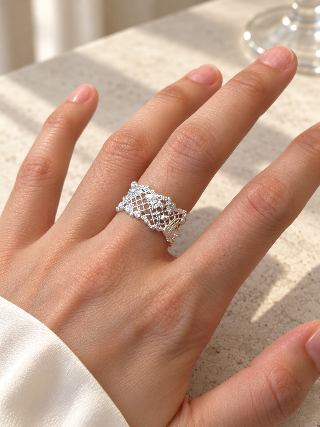 TIDAL VEIL wide silver lace ring worn on the hand