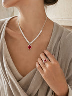 GROUND RITUAL SET of Necklace with a red agate and matching ring on a neutral background