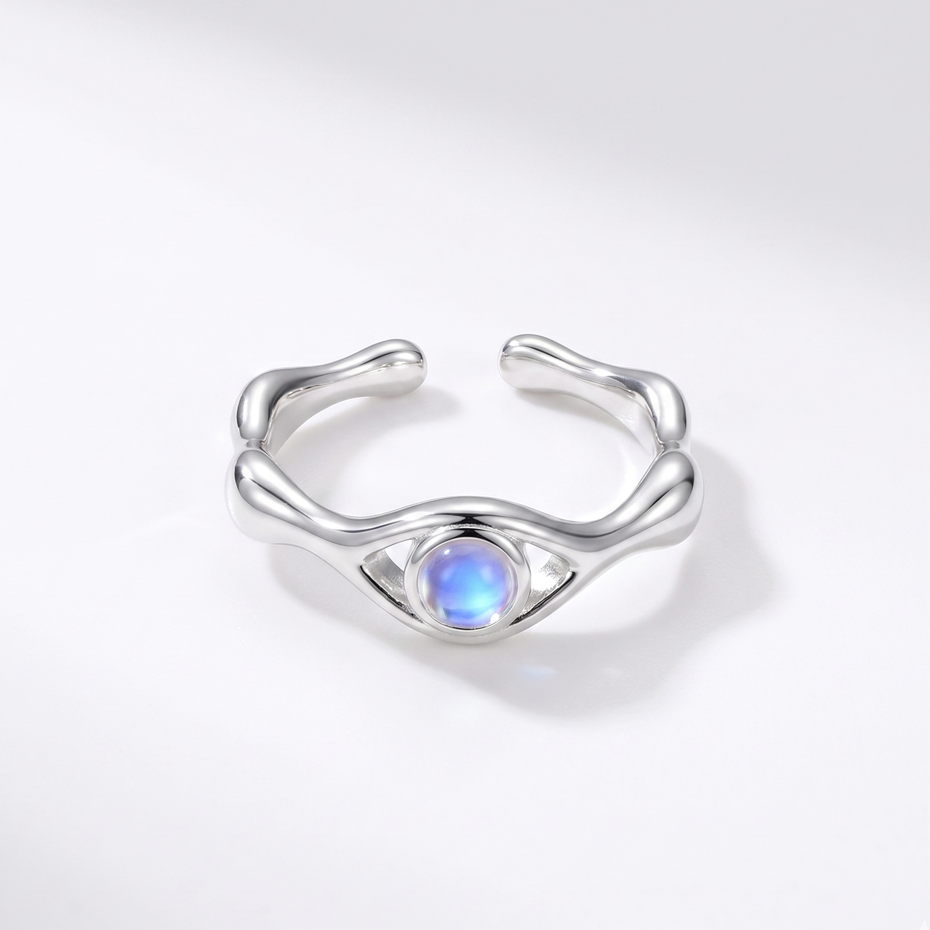 Silver ring with moonstone on a white background