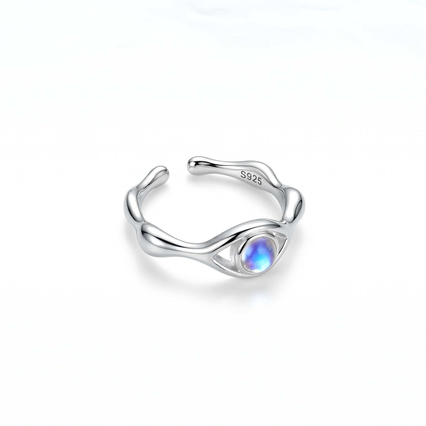 Silver ring with a moonstone on a white background side view