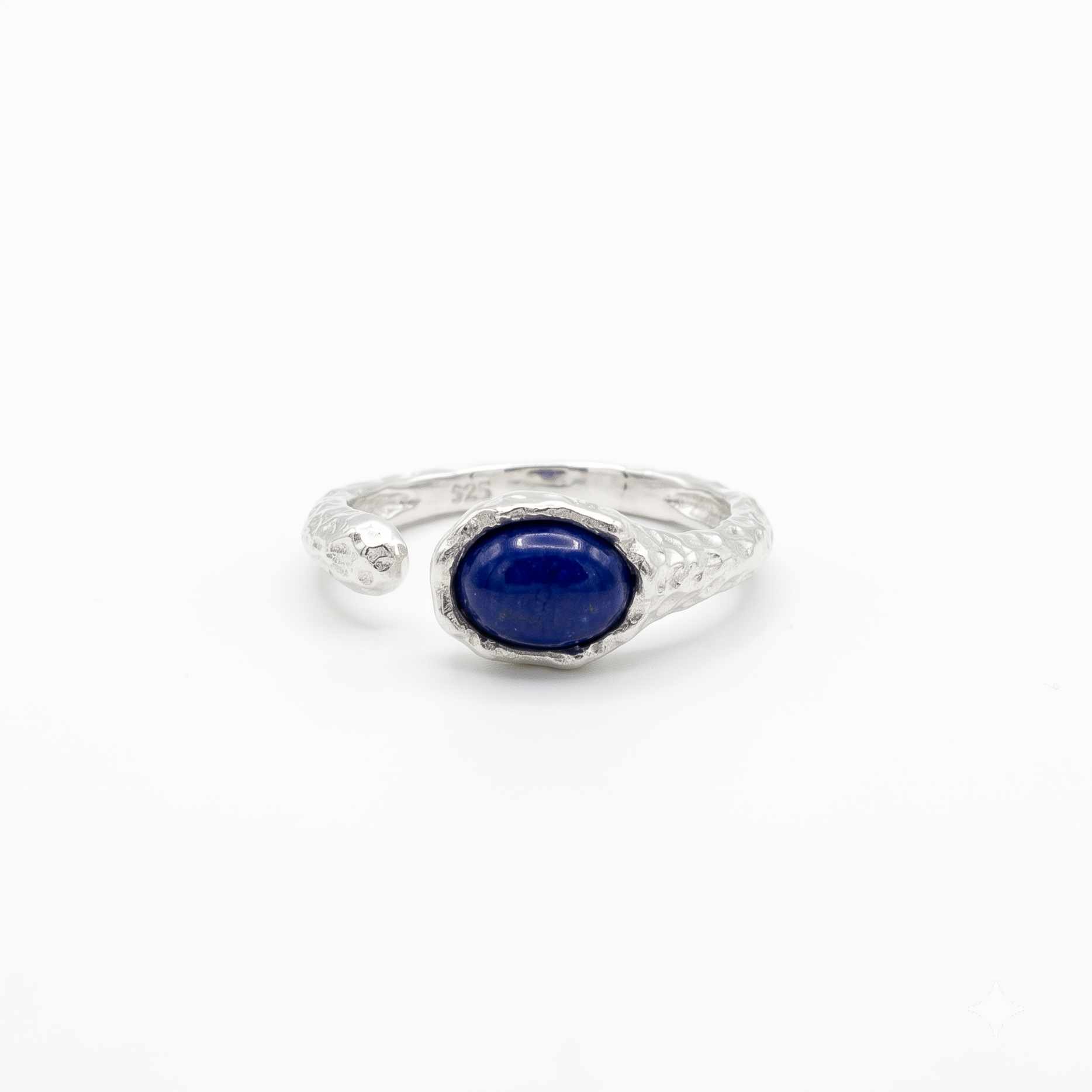 Silver ring with a blue gemstone on a white background